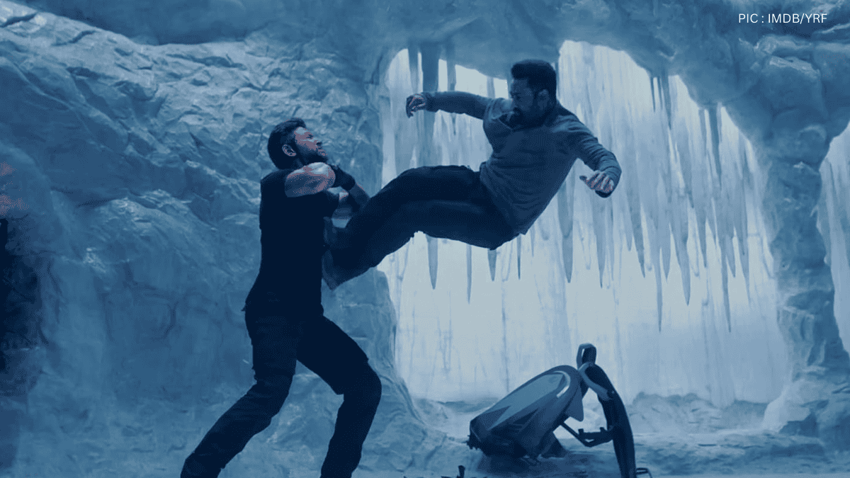 Two men engaged in a dramatic mid-air fight in an icy cave setting, with action and intensity.